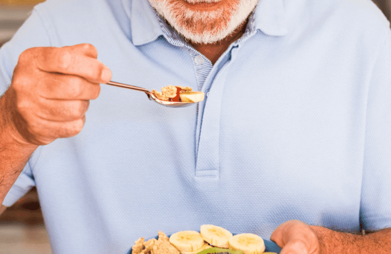 Close up of a man eating being mindful of his senior nutrition.
