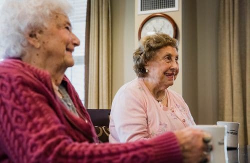 women smiling in assisted living community