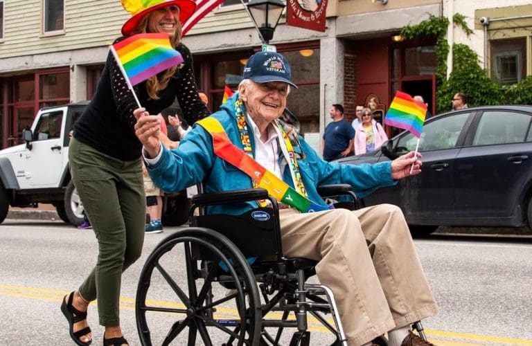 senior citizen celebrating pride month in pride parade LGBTQ+
