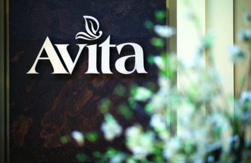 Avita memory care logo with plant background