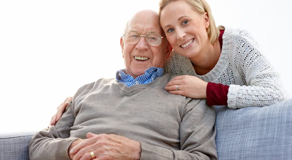 woman with her father in memory care setting