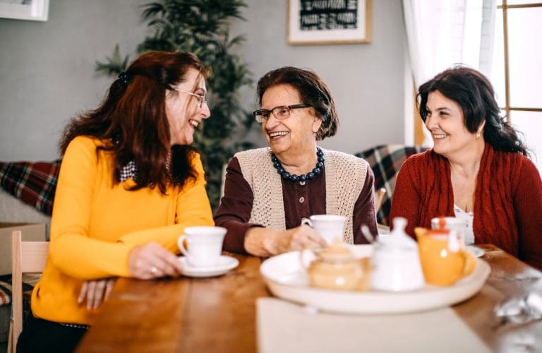 Three woman doing small talk at home