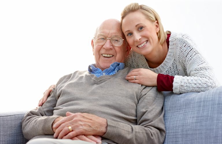 Pretty woman with her father at home