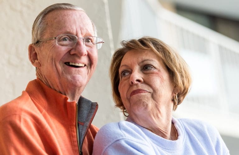 Smiling Senior Couple looking away